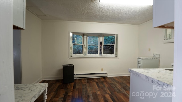 unfurnished bedroom featuring a textured ceiling, a baseboard radiator, and dark hardwood / wood-style floors