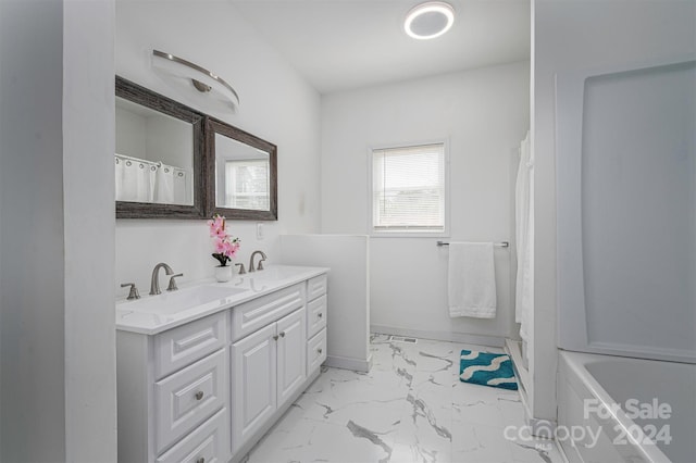 bathroom featuring vanity and shower / tub combo