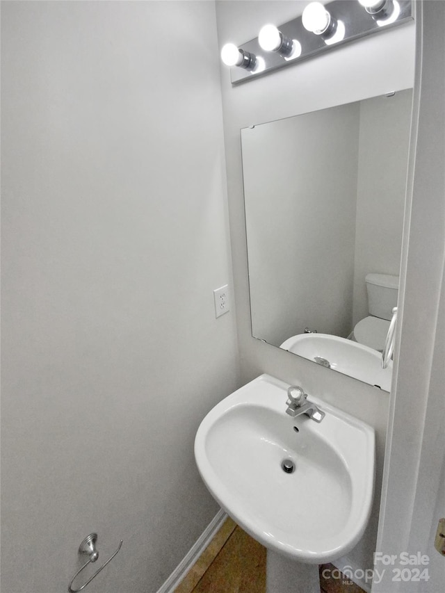 bathroom with sink and toilet