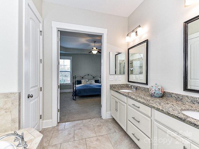 bathroom with tile patterned floors, ceiling fan, and vanity