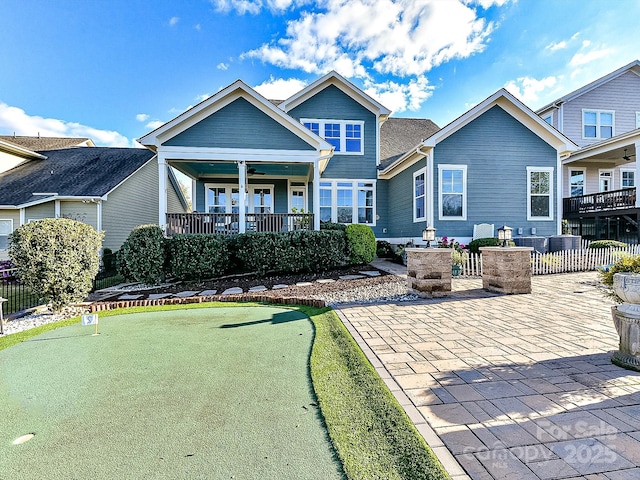 view of front of property featuring ceiling fan and a patio