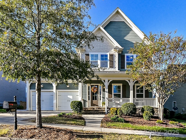 view of front of house with a porch and a garage