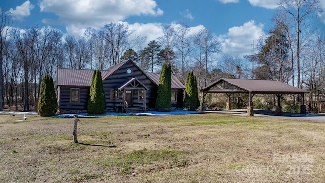 view of front of property with a carport and a front lawn