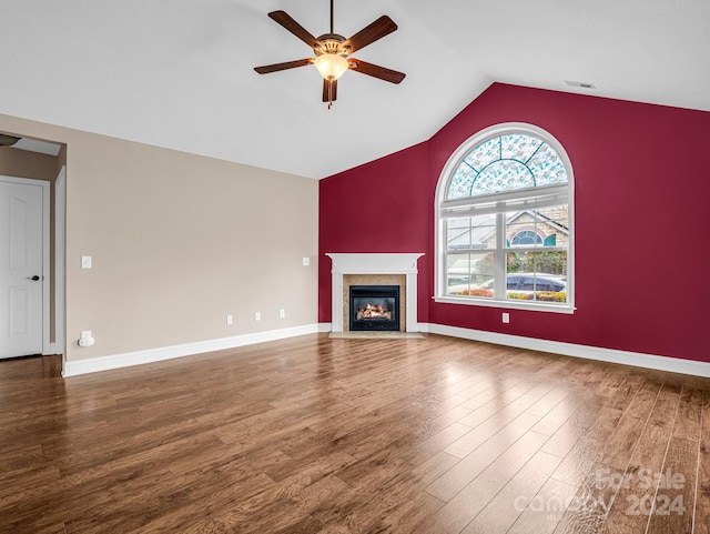 unfurnished living room with vaulted ceiling, hardwood / wood-style flooring, and ceiling fan