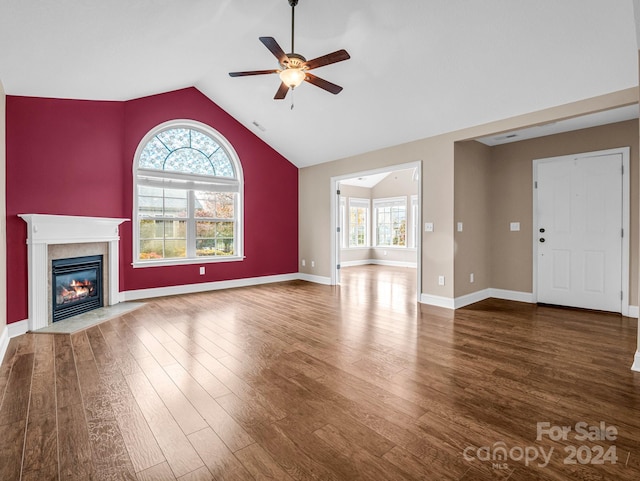 unfurnished living room featuring vaulted ceiling, ceiling fan, and dark hardwood / wood-style flooring