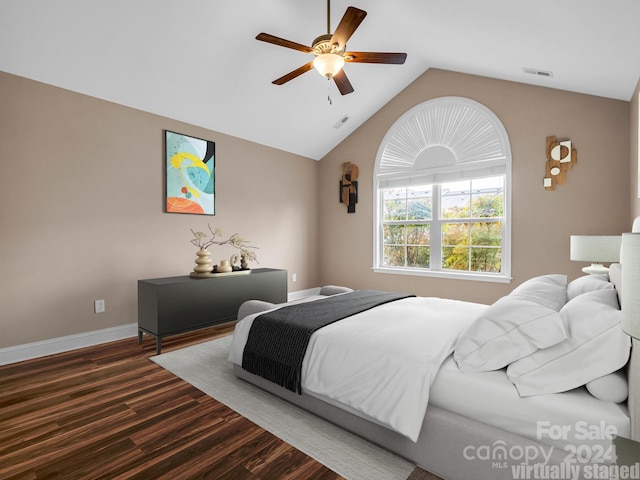 bedroom featuring dark wood-type flooring, ceiling fan, and vaulted ceiling