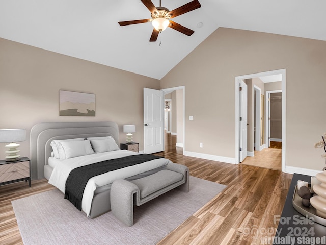 bedroom featuring high vaulted ceiling, wood-type flooring, and ceiling fan