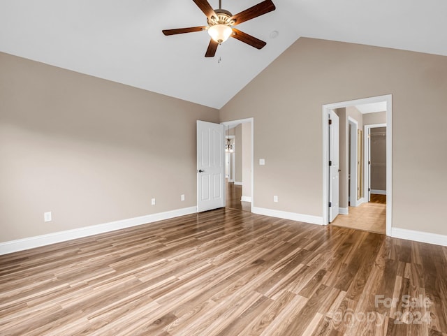 unfurnished room featuring high vaulted ceiling, light hardwood / wood-style floors, and ceiling fan