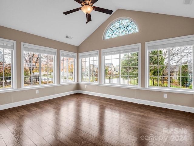 unfurnished sunroom with a wealth of natural light, lofted ceiling, and ceiling fan