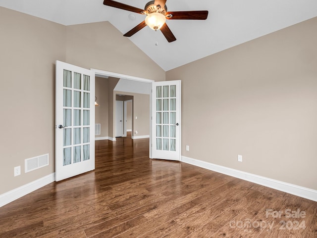 empty room featuring dark wood-type flooring, ceiling fan, high vaulted ceiling, and french doors