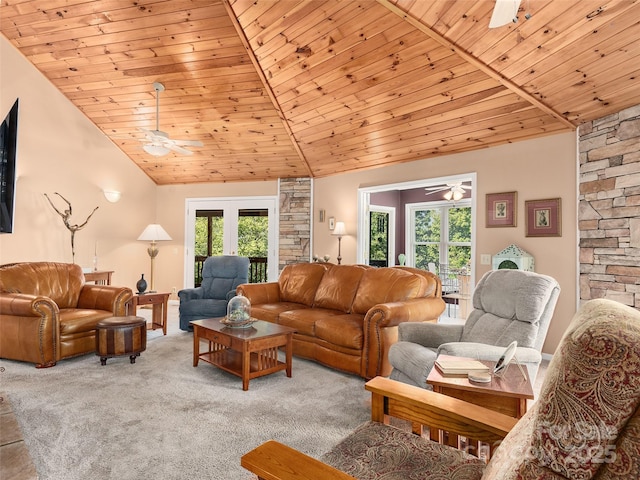 living room with ceiling fan, wood ceiling, light colored carpet, and high vaulted ceiling