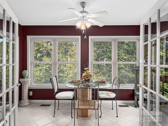 sunroom with french doors and ceiling fan