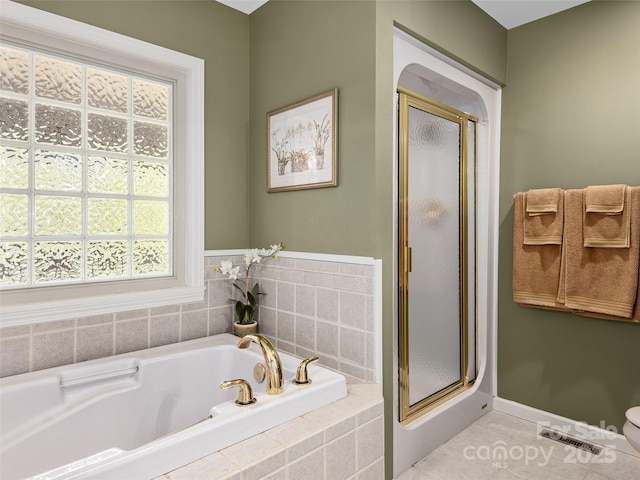 bathroom featuring independent shower and bath and tile patterned floors