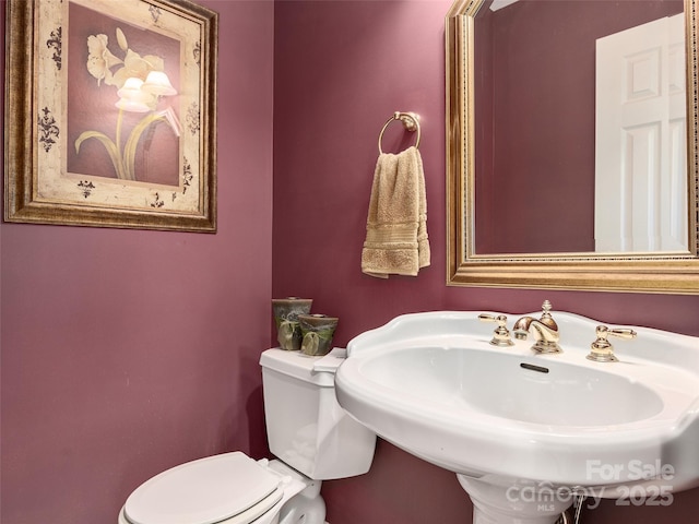 bathroom with sink and toilet