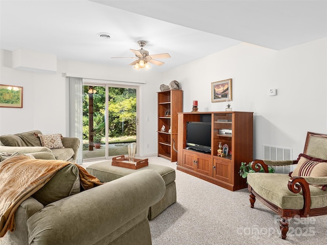 living room with light carpet and ceiling fan