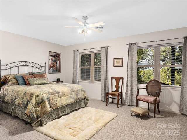 carpeted bedroom with ceiling fan