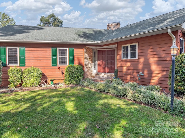 121 Canoe Dr, Mill Spring, NC 28756 - view of front of home featuring a front yard, stone siding, a chimney, and a shingled roof