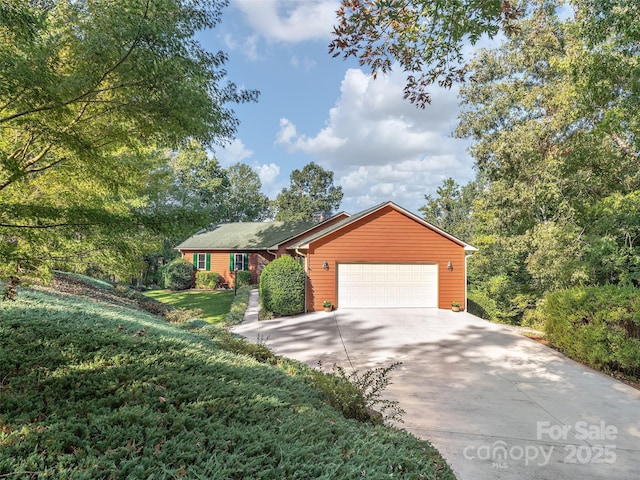 121 Canoe Dr, Mill Spring, NC 28756 - ranch-style home featuring a garage, driveway, and a front lawn