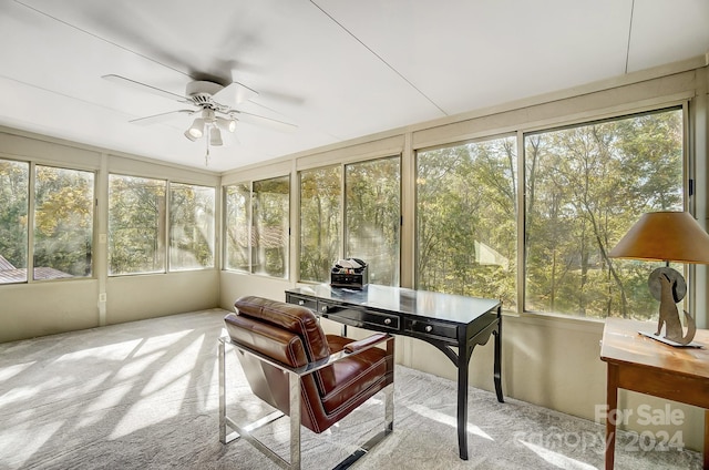 sunroom featuring a wealth of natural light and ceiling fan