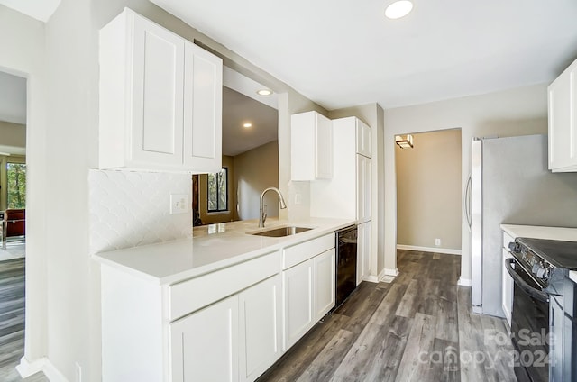 kitchen with white cabinets, decorative backsplash, black appliances, sink, and dark hardwood / wood-style floors