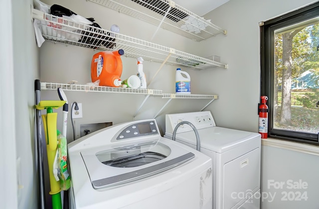 washroom featuring independent washer and dryer