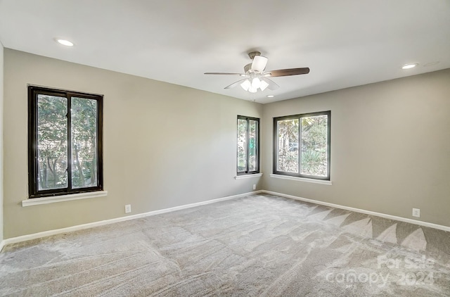 carpeted empty room with ceiling fan