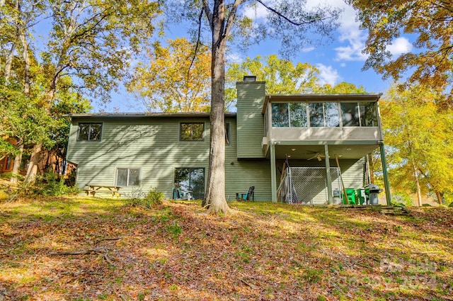 back of house featuring a sunroom