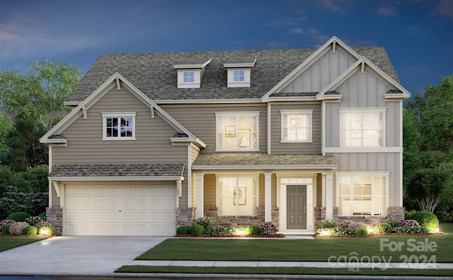 craftsman-style house with a garage and a front yard