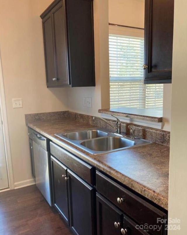 kitchen with dark brown cabinets, sink, stainless steel dishwasher, and dark hardwood / wood-style flooring