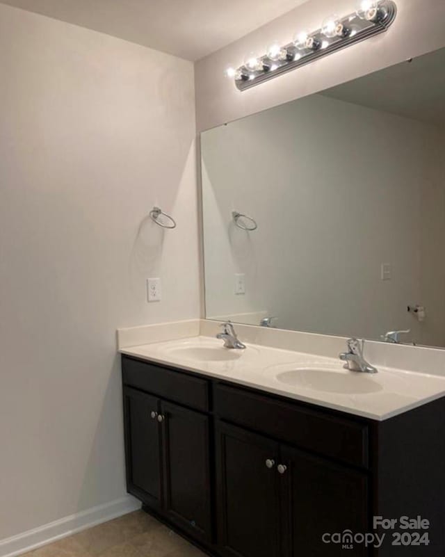 bathroom with vanity and tile patterned floors