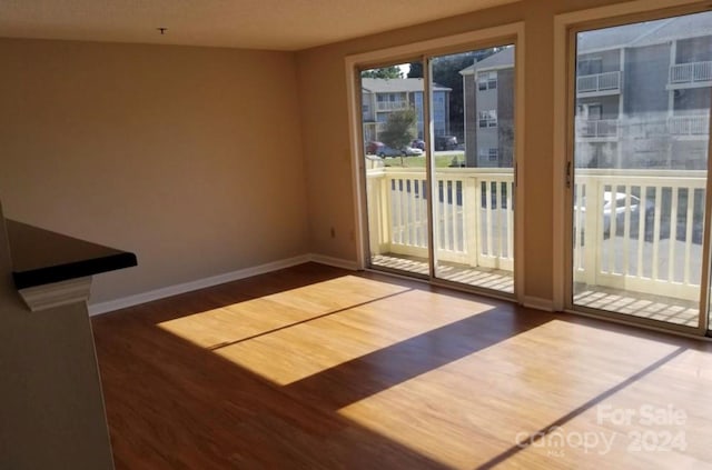 doorway with dark hardwood / wood-style flooring