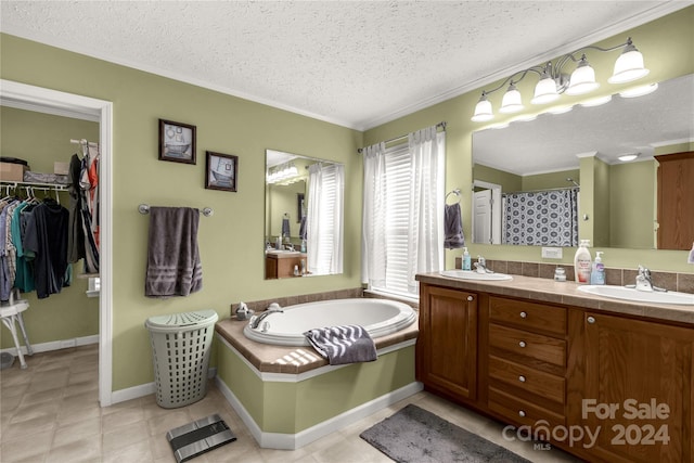 bathroom featuring vanity, crown molding, shower with separate bathtub, and a textured ceiling