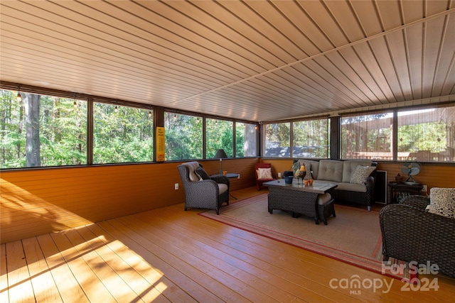 sunroom / solarium featuring wooden ceiling and plenty of natural light