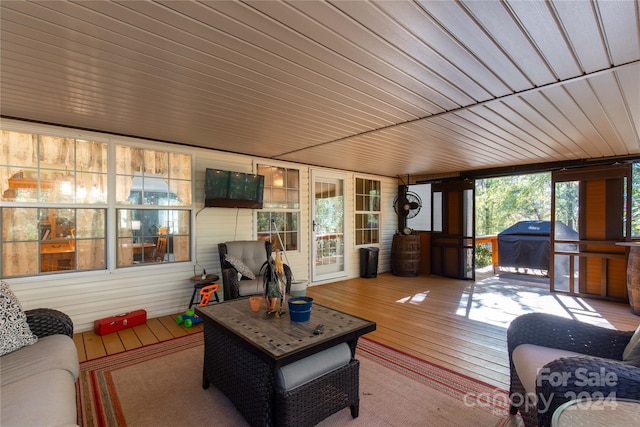 sunroom featuring wood ceiling