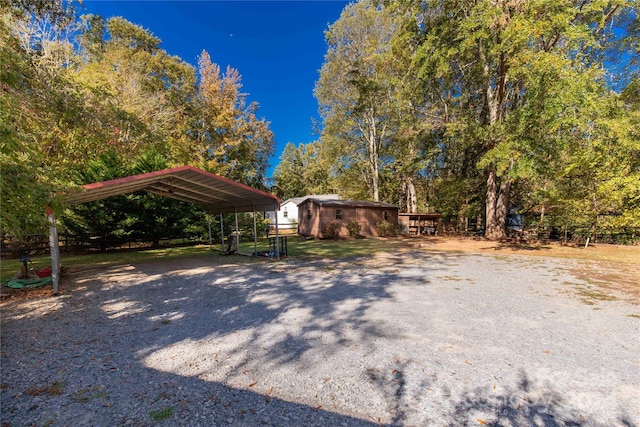 exterior space with a carport