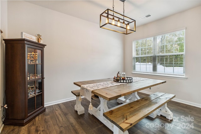 dining space with dark wood-type flooring