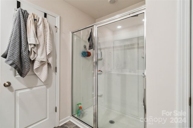 bathroom with an enclosed shower