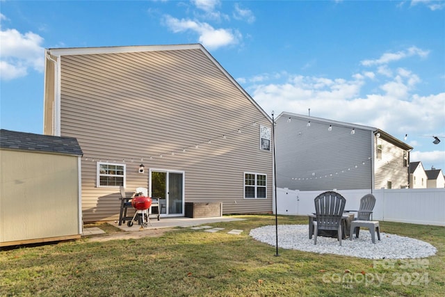 rear view of house featuring a patio and a lawn