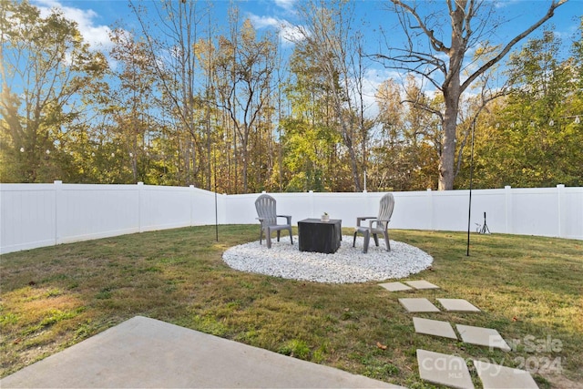 view of yard featuring an outdoor fire pit and a patio