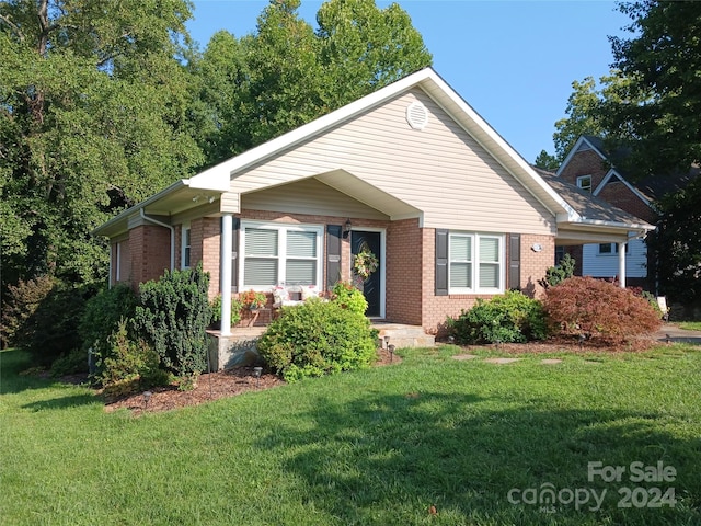 309 Rodoret St N, Valdese, NC 28690 - view of front facade with brick siding and a front yard