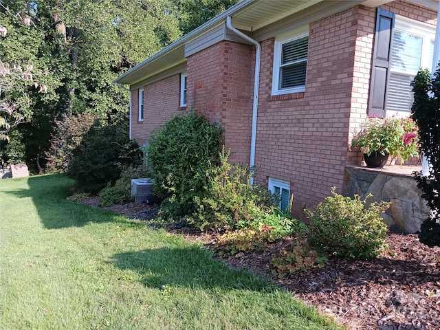 309 Rodoret St N, Valdese, NC 28690 - view of property exterior with brick siding, a yard, and central air condition unit