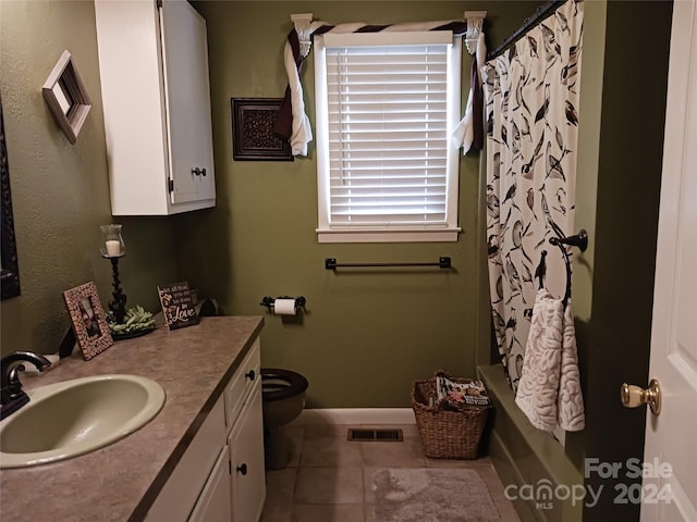 309 Rodoret St N, Valdese, NC 28690 - full bathroom featuring vanity, toilet, visible vents, baseboards, and tile patterned flooring
