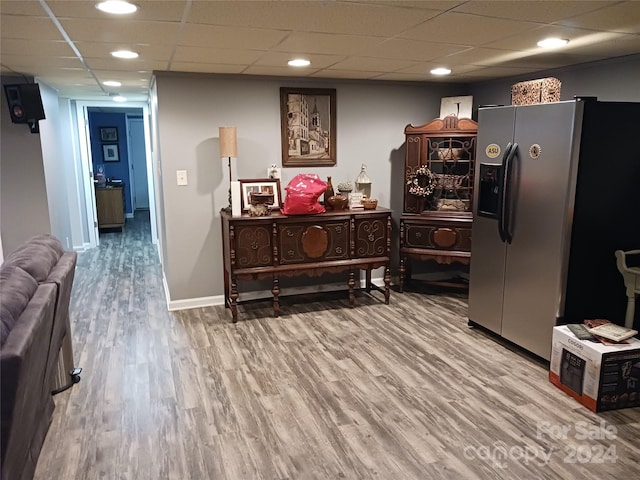 309 Rodoret St N, Valdese, NC 28690 - kitchen with wood finished floors, a drop ceiling, baseboards, and stainless steel fridge with ice dispenser