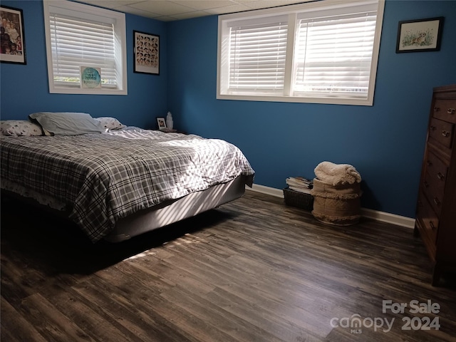 309 Rodoret St N, Valdese, NC 28690 - bedroom with wood finished floors, a drop ceiling, multiple windows, and baseboards