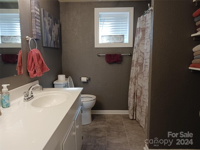 309 Rodoret St N, Valdese, NC 28690 - full bath featuring toilet, a textured wall, vanity, and baseboards