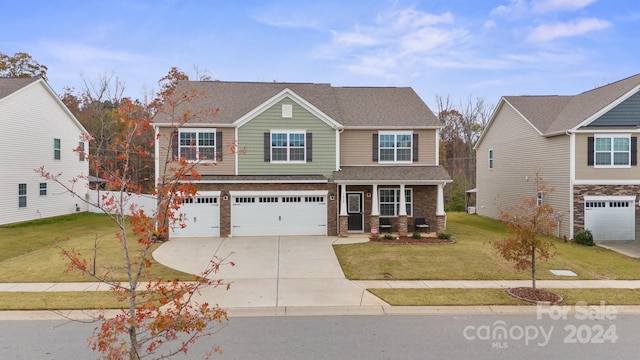 craftsman-style home with a front yard and a garage