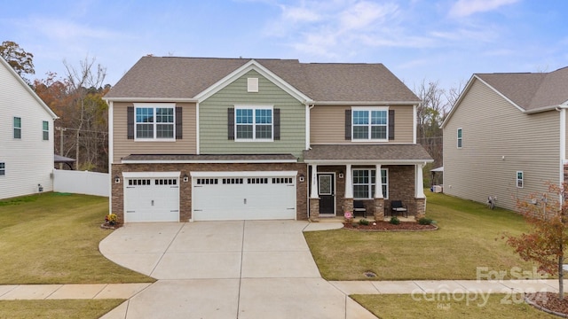 craftsman-style home featuring a garage and a front lawn