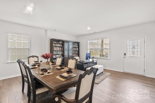 dining space featuring wood-type flooring