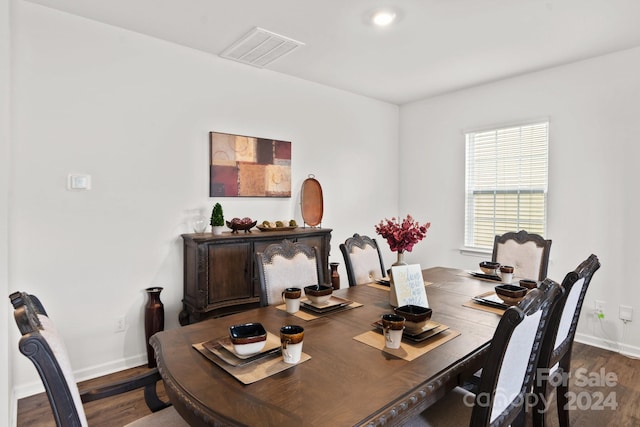 dining area featuring dark hardwood / wood-style flooring