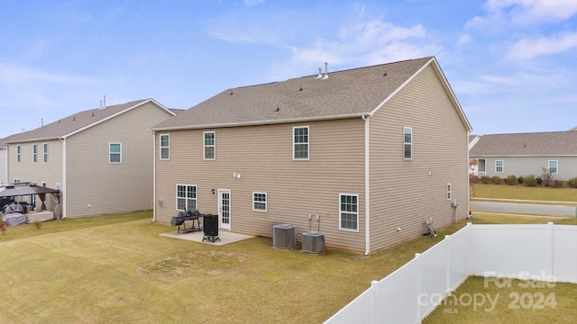 back of property with cooling unit and a patio